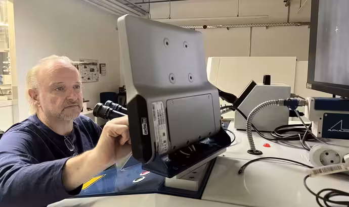 The helpers in the background